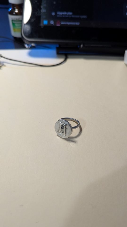 Moon Ring: a round silver signet ring with a crescent moon motif