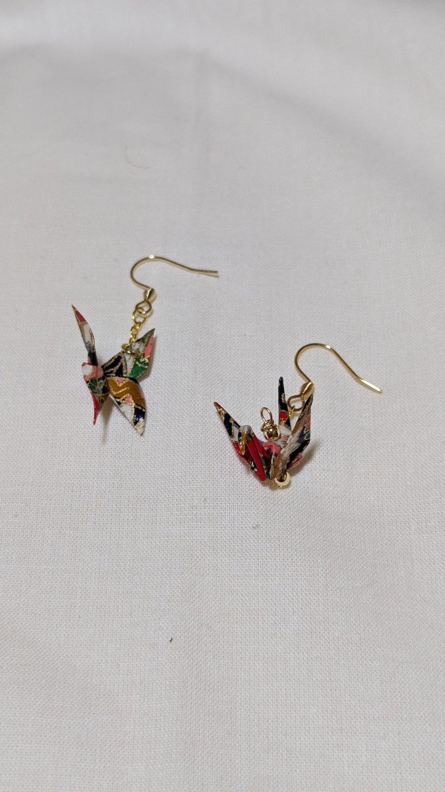Origami Earrings: a pair of folded chiyogami paper cranes on gold-fill ear hooks