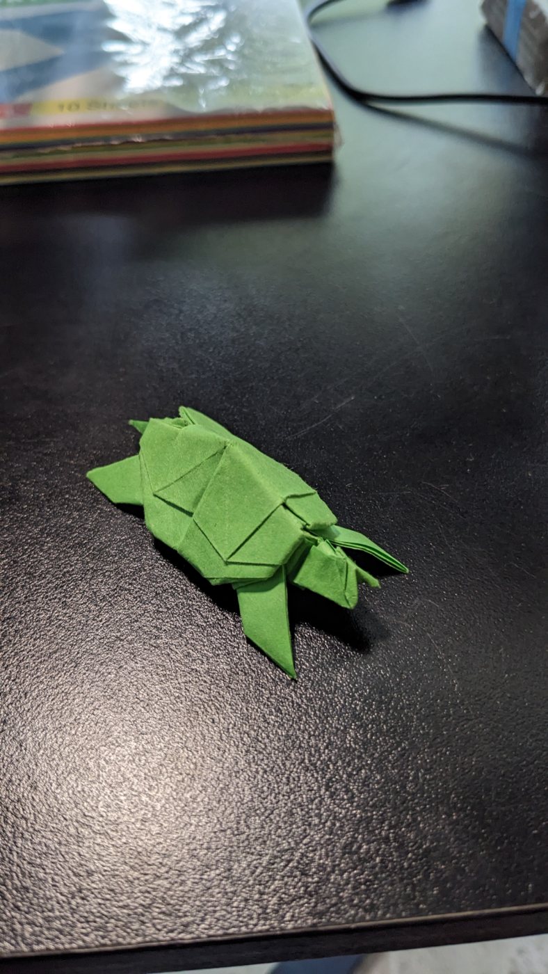 Green origami turtle