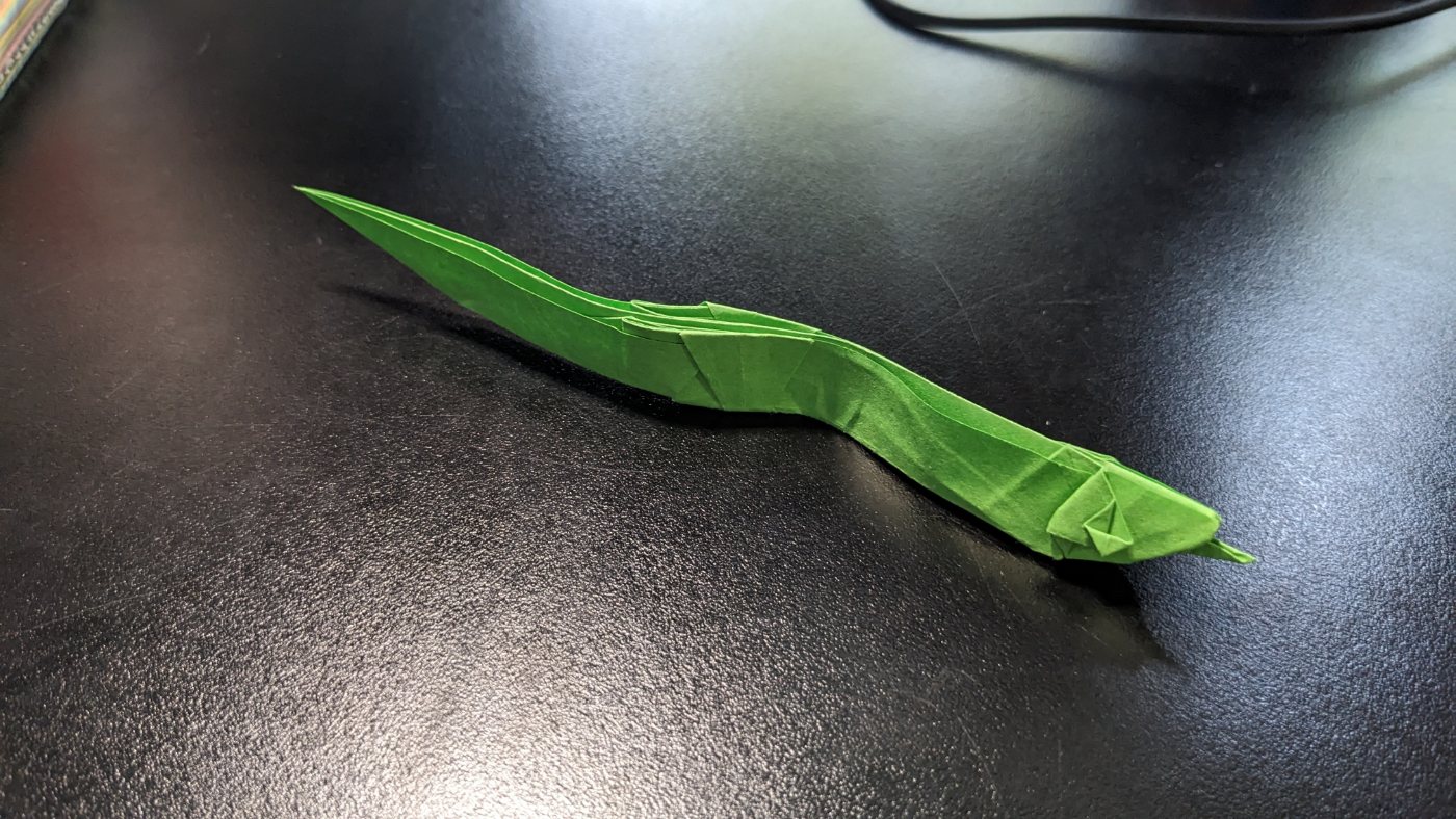 Green origami snake