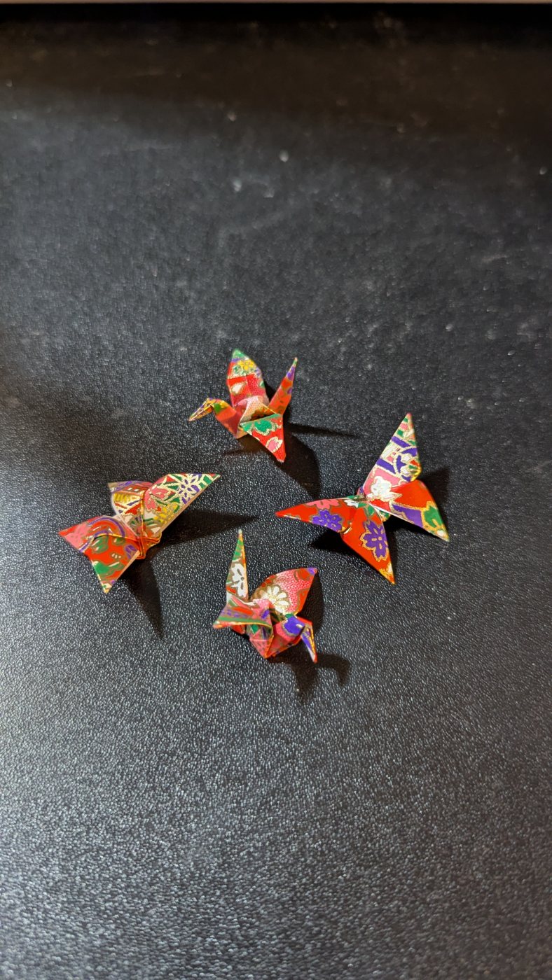 Washi-paper origami cranes and butterflies