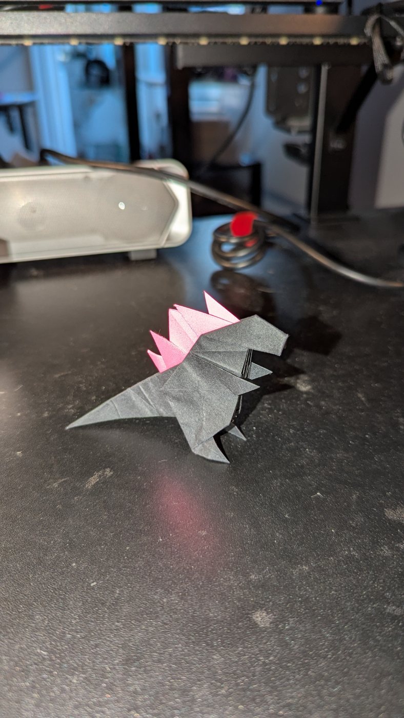 Black and pink origami dinosaur
