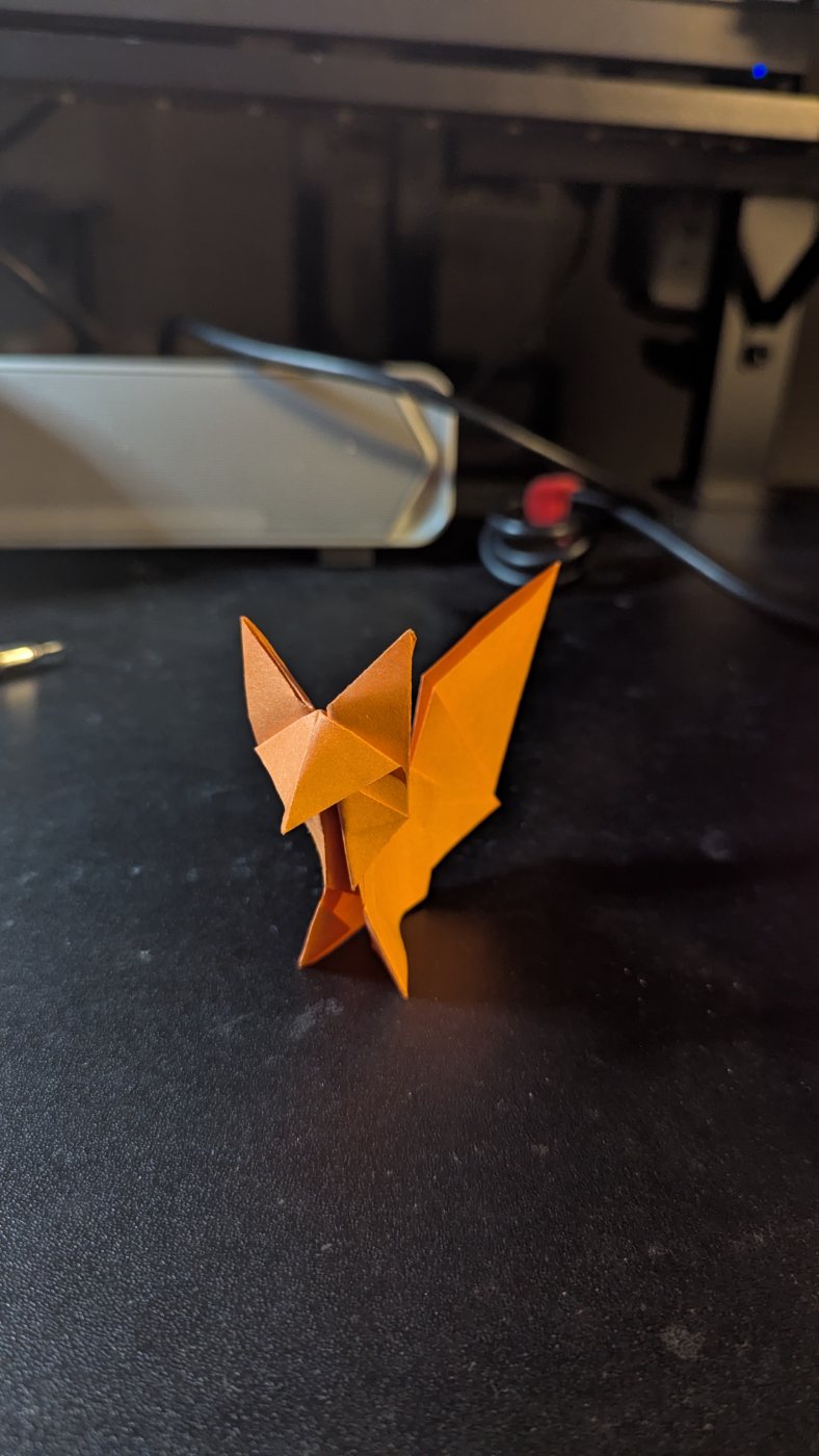 Orange origami winged fox