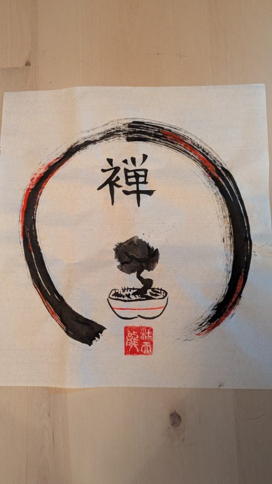 Ensō circle in black and red ink enclosing a bonsai, with the kanji 禅 and a red seal