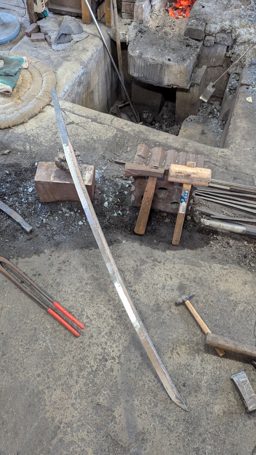 The blade after quenching, now curved